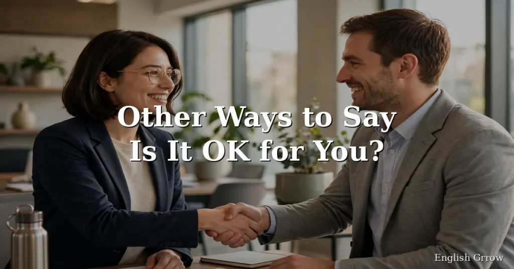 Two professionals smiling and shaking hands in agreement in a bright modern office